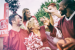 Group of football fans wearing team colors