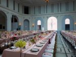 Pink and white themed tables at an event