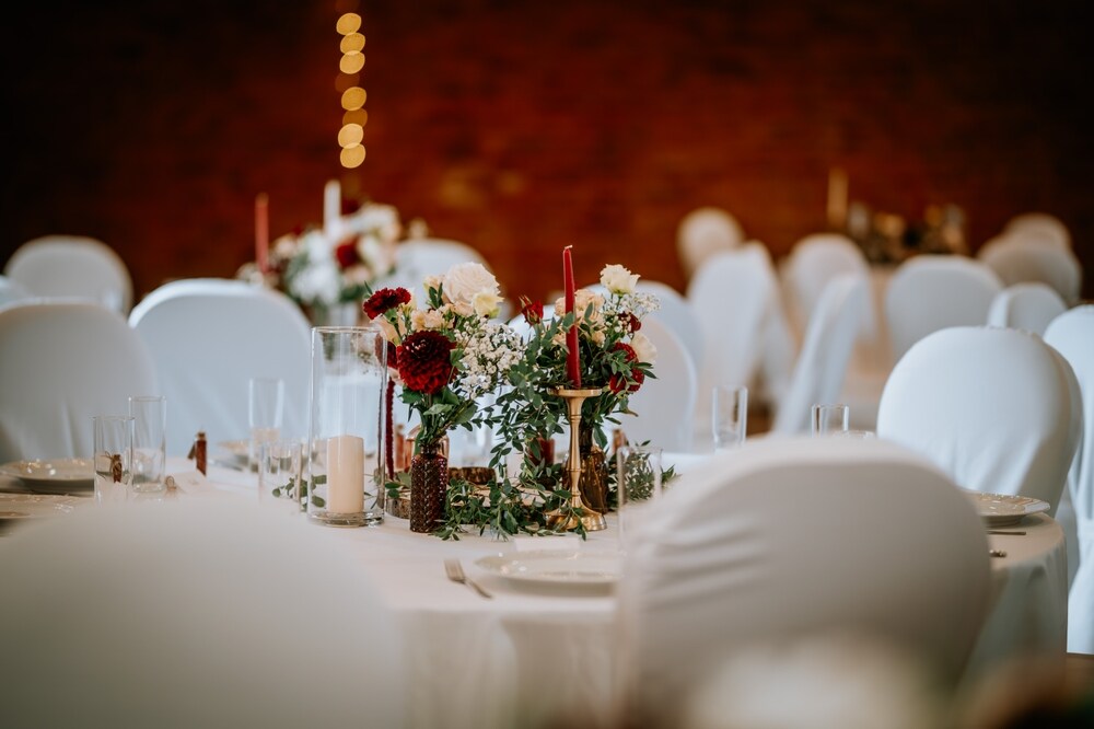 A winter wedding featuring chairs with white chair seat covers