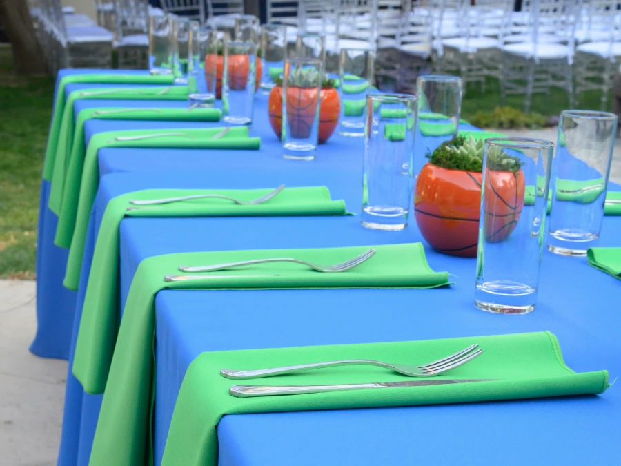 Blue and green table linens at a basketball-themed bar mitzvah